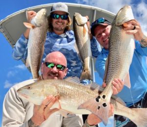 Every rod with bait would go off at the same time with oversized redfish leading to multiple double, triple, and quadruple hook ups.